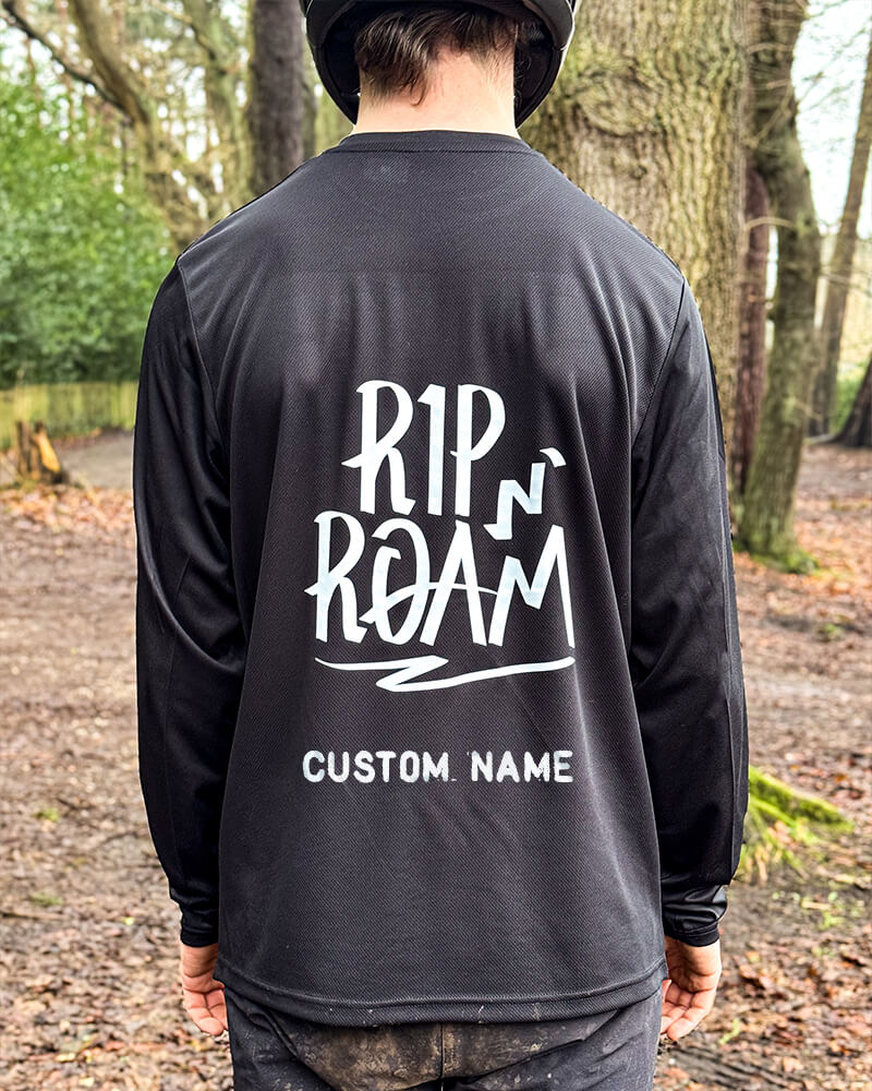 Back of the Wild x Free MTB Jersey showing bold RipN’Roam logo